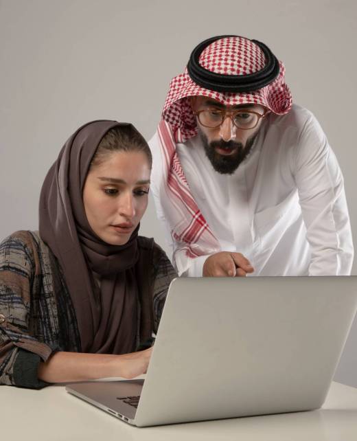 Two,Employees,Discussing,In,The,Laptop,On,Withe,Background